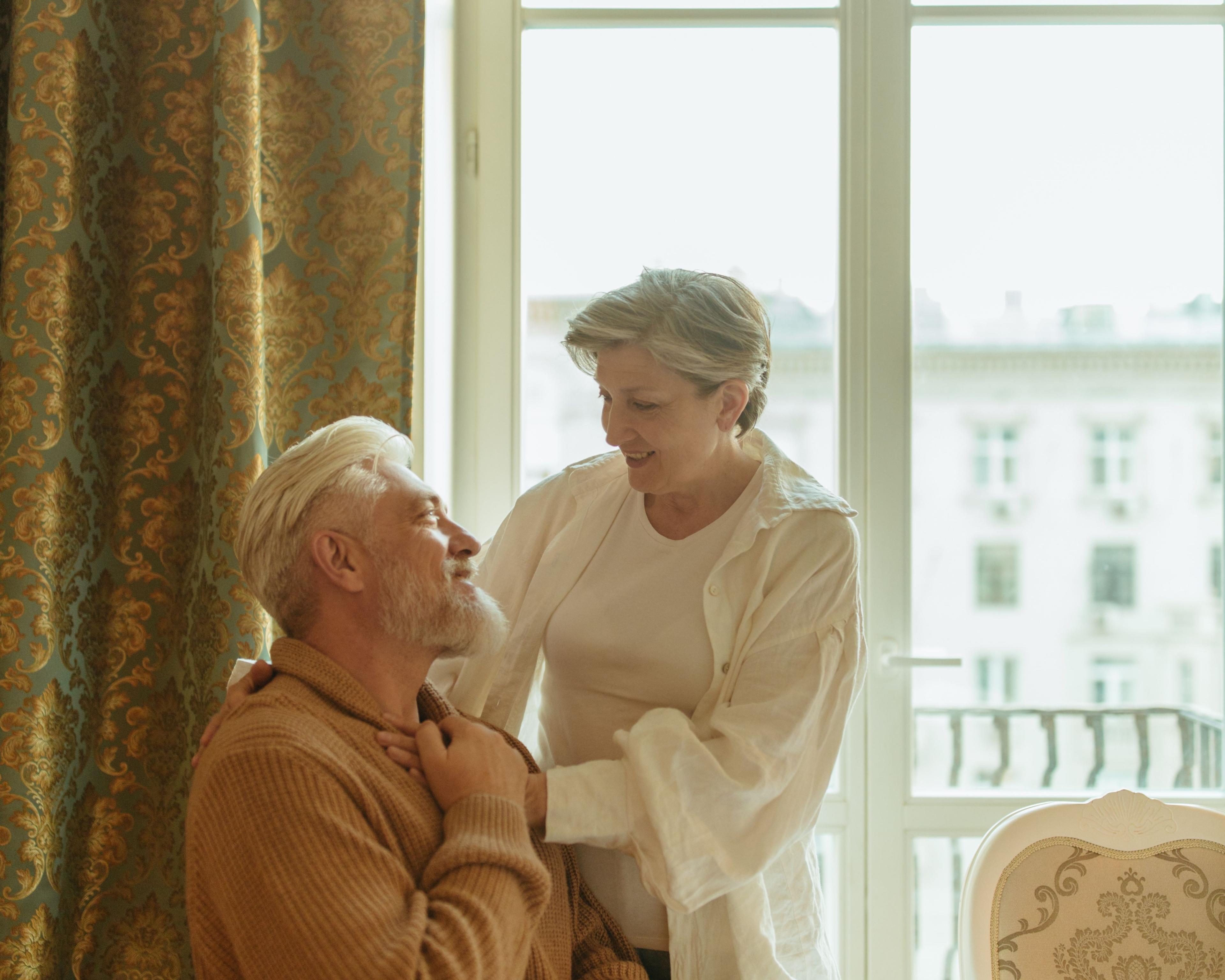 A caring professional supporting an older person at home